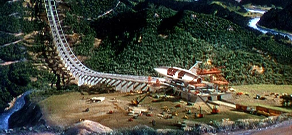 From When Worlds Collide, a rocket ship sits at the end of a coaster-style ramp, preparing to launch.