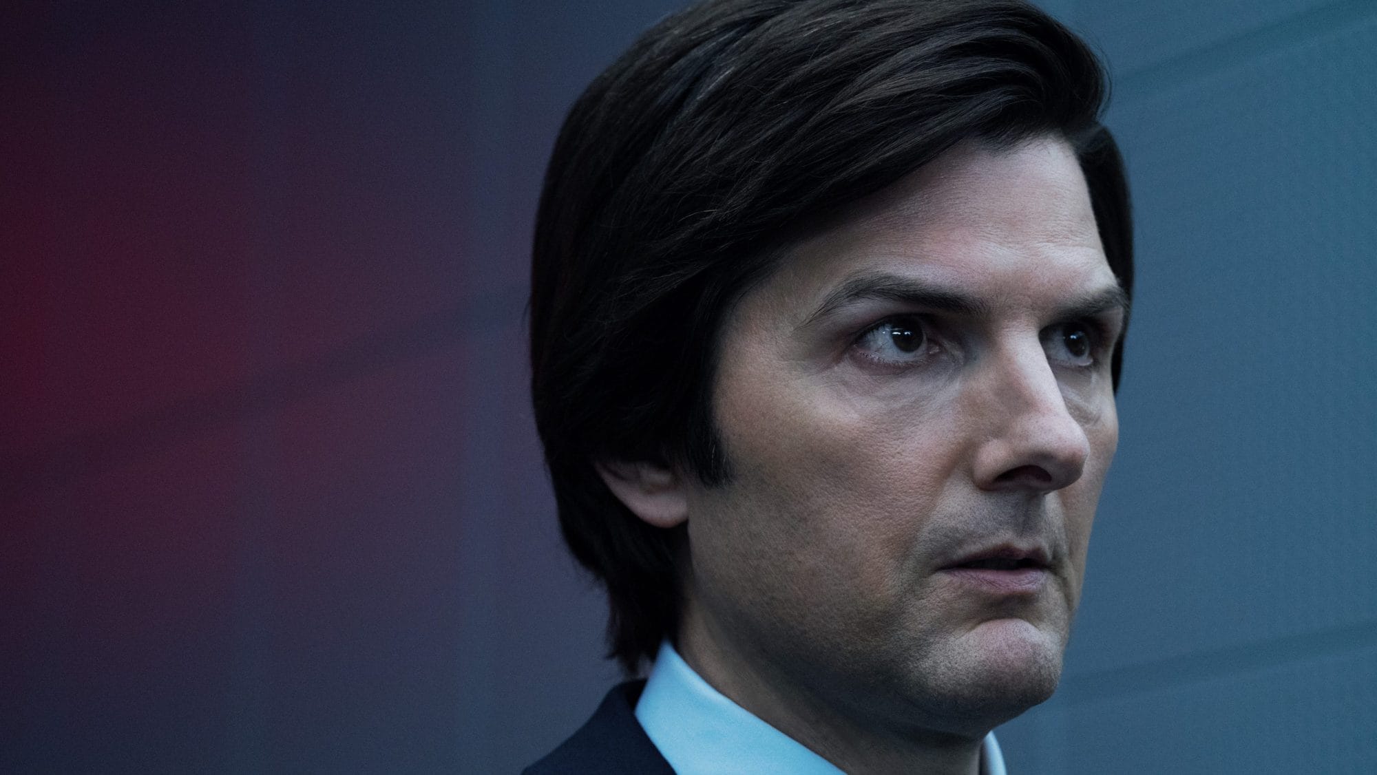 Adam Scott is very concerned about something outside of the frame.