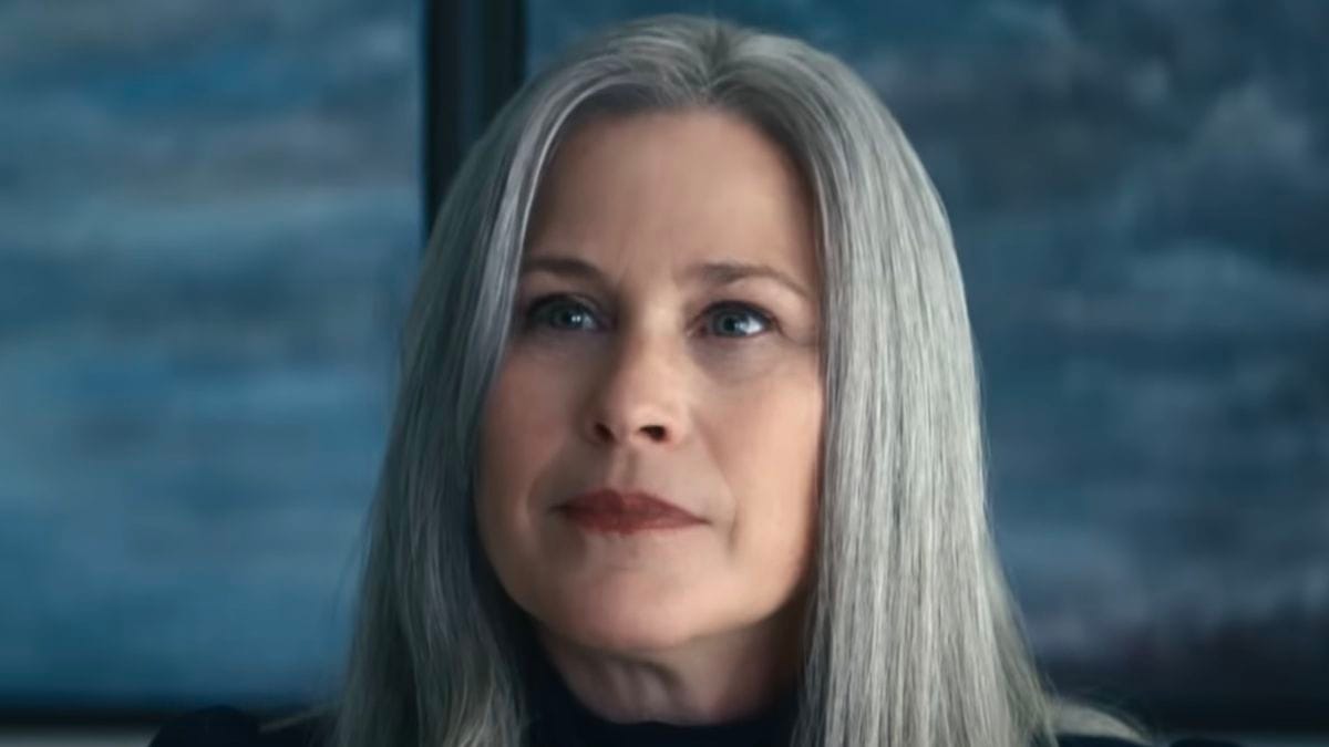 Patricia Arquette looks quietly pleased at something just outside of the frame, and it's unsettling in context.