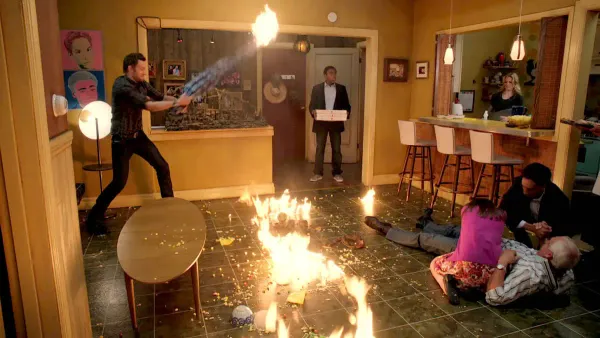 An apartment on fire in a scene from Community