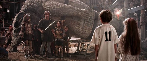 Peter Pan played by Robin Williams looks at his kids in a scene from Hook (1991)