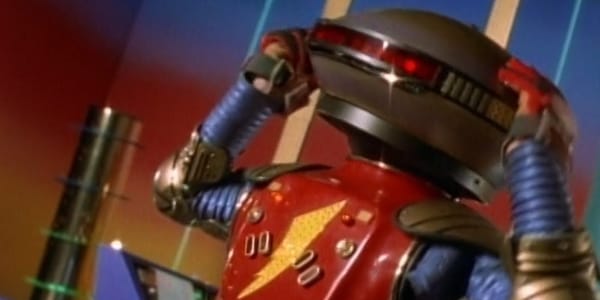 A canted angle shot of robot Alpha 5 expressing some anxiety from the Mighty Morphin' Power Rangers.