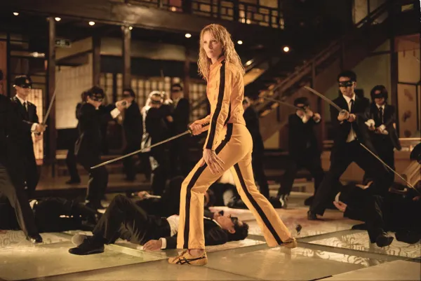 Uma Thurman stands with a samurai sword in a still from Kill Bill
